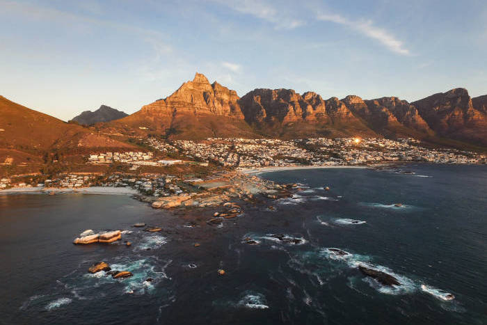 Aerial photo of the sea and mountains by Camps Bay